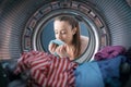 Woman smelling freshly washed laundry Royalty Free Stock Photo