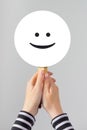 Happy woman with smiley emoticon Royalty Free Stock Photo