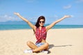 Happy woman smiling at the beach on a sunny day Royalty Free Stock Photo