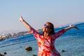 Happy woman smiling at the beach on a sunny day Royalty Free Stock Photo