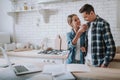 Happy woman smiling while offering tea to her husband Royalty Free Stock Photo