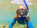 Happy woman in snorkeling mask dive underwater with tropical fishes in coral reef sea pool. Travel lifestyle, water Royalty Free Stock Photo