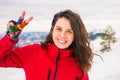 Happy woman on a on snow covered mountain Royalty Free Stock Photo