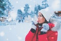 Happy woman in a snow landscape