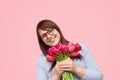 Happy woman with spring flowers for holiday