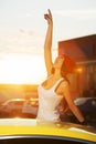 Happy young fashion woman by her car Royalty Free Stock Photo