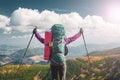 Happy woman standing on a mountain top with raised hands Royalty Free Stock Photo