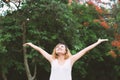 Happy woman standing stretch her arms in the air. Enjoy fresh ai Royalty Free Stock Photo