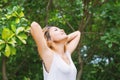 Happy woman standing stretch her arms in the air. Enjoy fresh ai Royalty Free Stock Photo