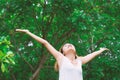 Happy woman standing stretch her arms in the air. Enjoy fresh ai Royalty Free Stock Photo