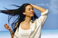 Happy woman standing in summer wind Royalty Free Stock Photo