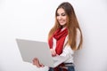 Happy woman standing and using laptop Royalty Free Stock Photo