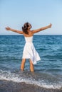 Happy woman stays in a sea water. Royalty Free Stock Photo