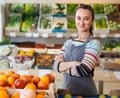 Happy woman store worker in supermarket