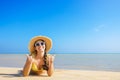 happy woman in straw hat and sunglasses lying on sand beach Royalty Free Stock Photo