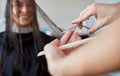 Happy woman with stylist cutting hair at salon Royalty Free Stock Photo