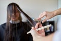 Happy woman with stylist cutting hair at salon Royalty Free Stock Photo