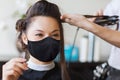 Happy woman with stylist making hairdo at salon Royalty Free Stock Photo