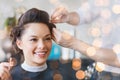 Happy woman with stylist making hairdo at salon Royalty Free Stock Photo