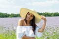 Happy woman in summer field. Young girl relax outdoors. Freedom concept. Royalty Free Stock Photo