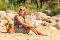 Happy woman sun tanning and relaxing on beach. Royalty Free Stock Photo