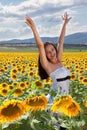 Happy woman in sunflower field Royalty Free Stock Photo