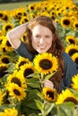 Happy Woman in a sunflower field Royalty Free Stock Photo