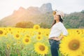 Happy woman in sunflower field smiling with happiness Royalty Free Stock Photo