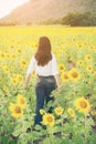 Happy woman in sunflower field smiling with happiness Royalty Free Stock Photo