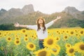 Happy woman in sunflower field smiling with happiness Royalty Free Stock Photo