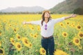 Happy woman in sunflower field smiling with happiness Royalty Free Stock Photo