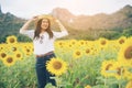 Happy woman in sunflower field smiling with happiness Royalty Free Stock Photo