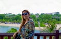 Happy woman in sunglasses on the beach in sentosa island Royalty Free Stock Photo