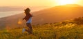 Happy woman on sunset in nature iwith open hands Royalty Free Stock Photo