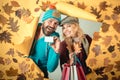 Happy woman and surprised man on Autumn background. Autumn copy space for trend vogue. Happy couple go shopping on black Royalty Free Stock Photo