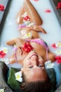 Happy woman taking pleasure in milk bath Royalty Free Stock Photo