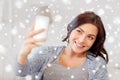 Happy woman taking selfie with smartphone at home Royalty Free Stock Photo