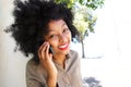 Happy woman talking on mobile phone outside Royalty Free Stock Photo