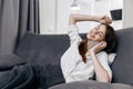 happy woman talking on the phone at home on the couch Royalty Free Stock Photo