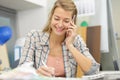 happy woman talking on phone while writing notes Royalty Free Stock Photo