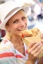 Happy woman tasting Focaccia sandwich Royalty Free Stock Photo