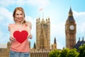 Happy woman or teen girl with red heart shape Royalty Free Stock Photo