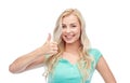 Happy woman or teenage girl showing thumbs up Royalty Free Stock Photo