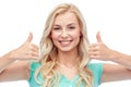 Happy woman or teenage girl showing thumbs up Royalty Free Stock Photo