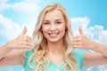 Happy woman or teenage girl showing thumbs up Royalty Free Stock Photo