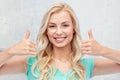 Happy woman or teenage girl showing thumbs up Royalty Free Stock Photo