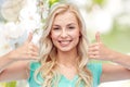 Happy woman or teenage girl showing thumbs up Royalty Free Stock Photo