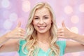 Happy woman or teenage girl showing thumbs up Royalty Free Stock Photo