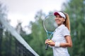 Happy woman with a tennis racket Royalty Free Stock Photo