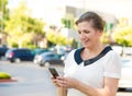 Happy woman texting on her smart phone